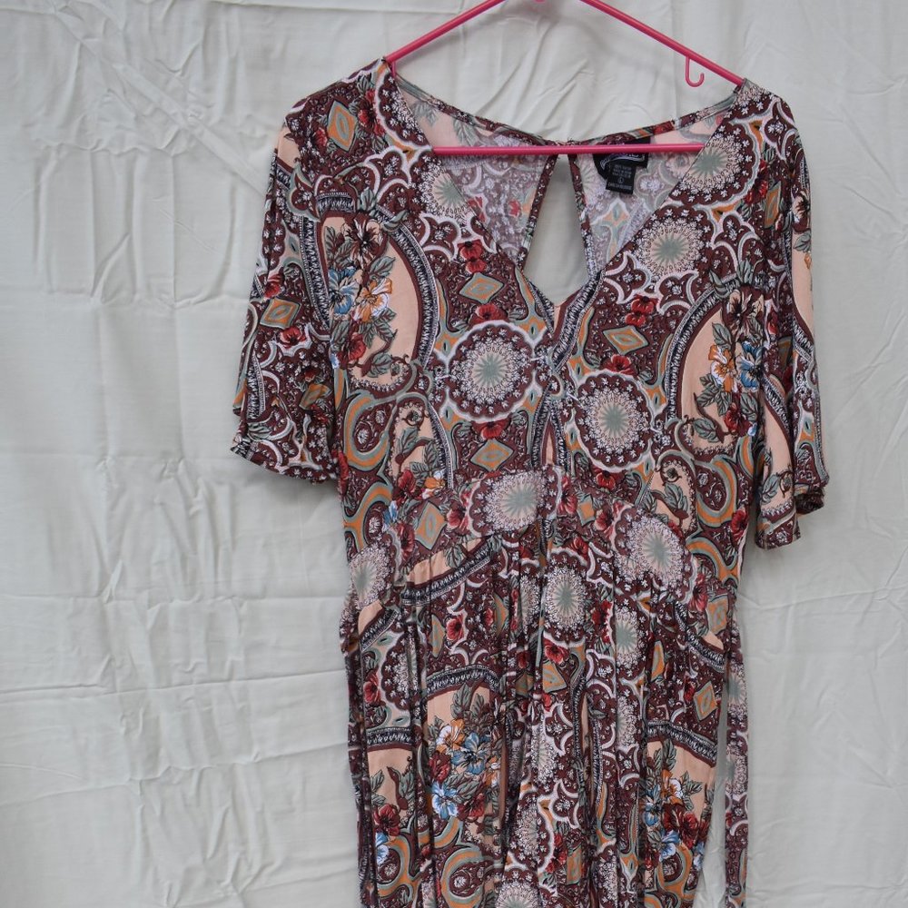 Colorful shorts romper with floor-length duster.